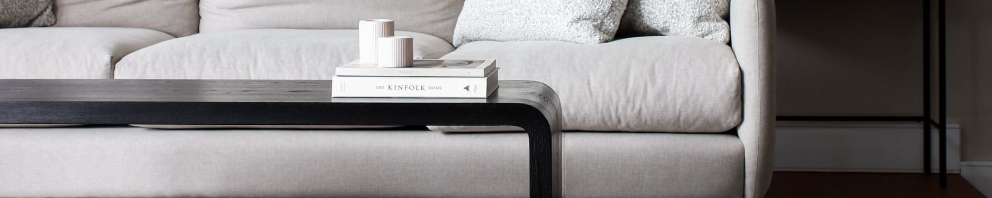 white couch and black coffee table on a gray carpet floor from Apollo Flooring Center in Tuscon, AZ